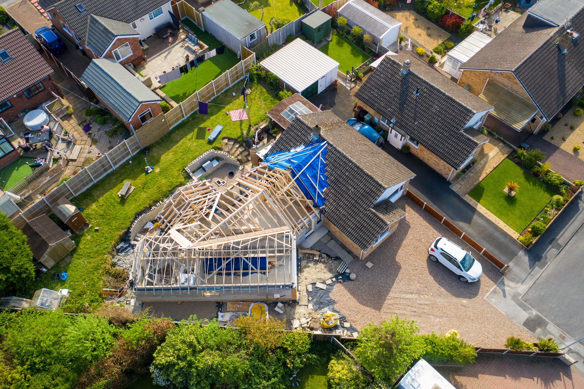Aerial photo of a typical british housing esate in the Village of Kippax in Leeds West Yorkshire, suburban housing estates and road in the village showing an extension being built on a property
